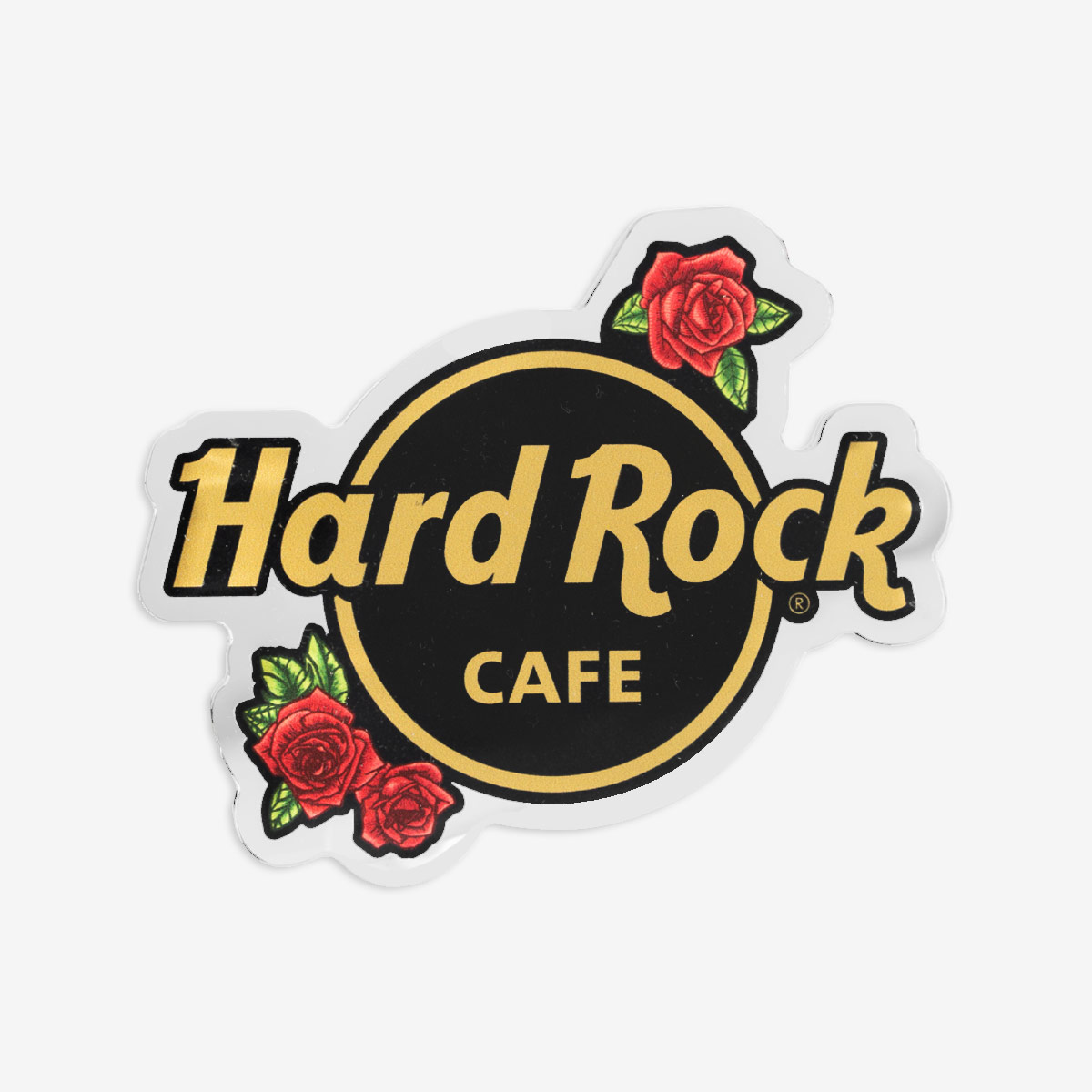 A front view of a Hard Rock logo Magnet with gold text and ring, red roses spring from the logo on the top right and bottom left of the logo.  image number 1